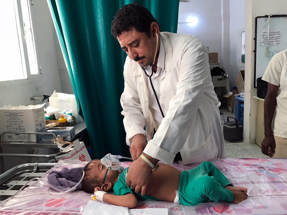 Doctor Mohammad Ahmed tends to a young patient at the Rural Hospital in Abs. 