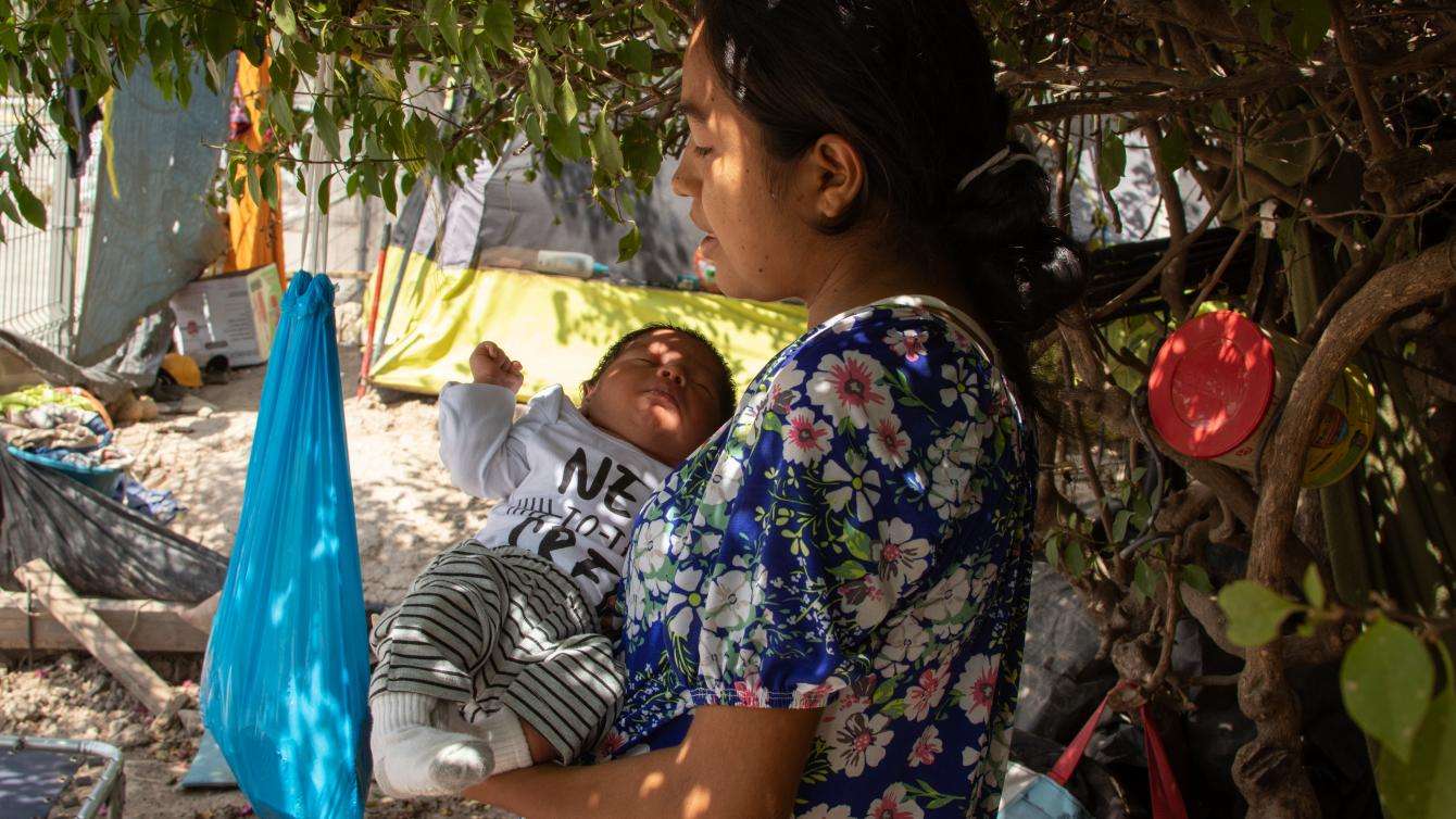 Elizabeth holds her son Carlos