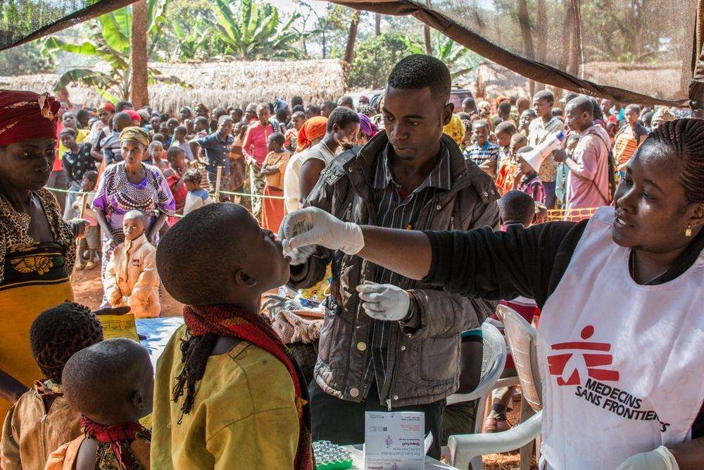 MSF staff treat people for cholera