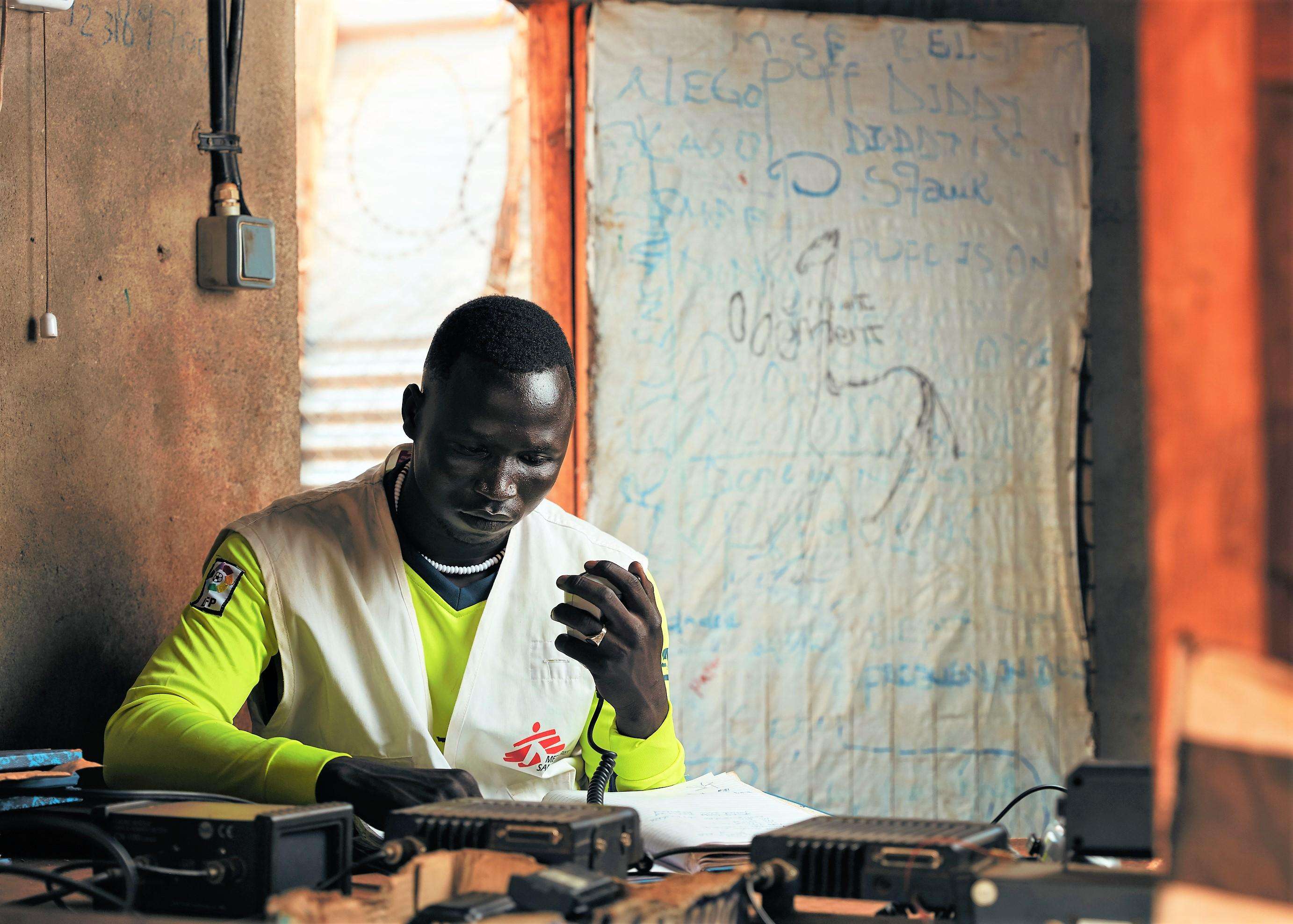 John, a radio operator, monitors and track movements of all the vehicles to make sure staff are safe and their location is known at all times. He also notes and records all the deliveries to the site.