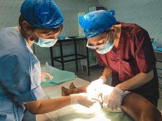 MSF doctors perform surgery in the operating theater at Bashair Teaching Hospital in Khartoum, Sudan.