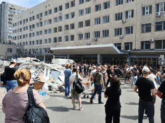 Rescuers finish clearing debris at the Kyiv children's hospital, which was bombed by Russian forces on July 8.