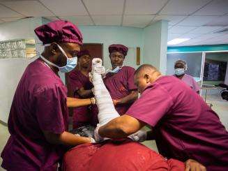 A medical team at MSF's emergency center in Turgeau, Port-au-Prince, is tending to a patient wounded during the Haiti earthquake. 