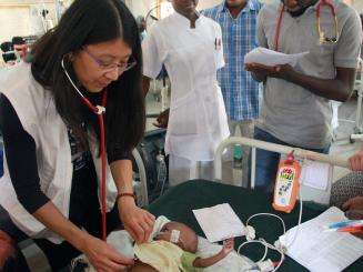 Dr. Joanne Liu caring for a child in Nigeria