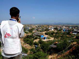 An MSF driver communicating with his walkie-talkie.