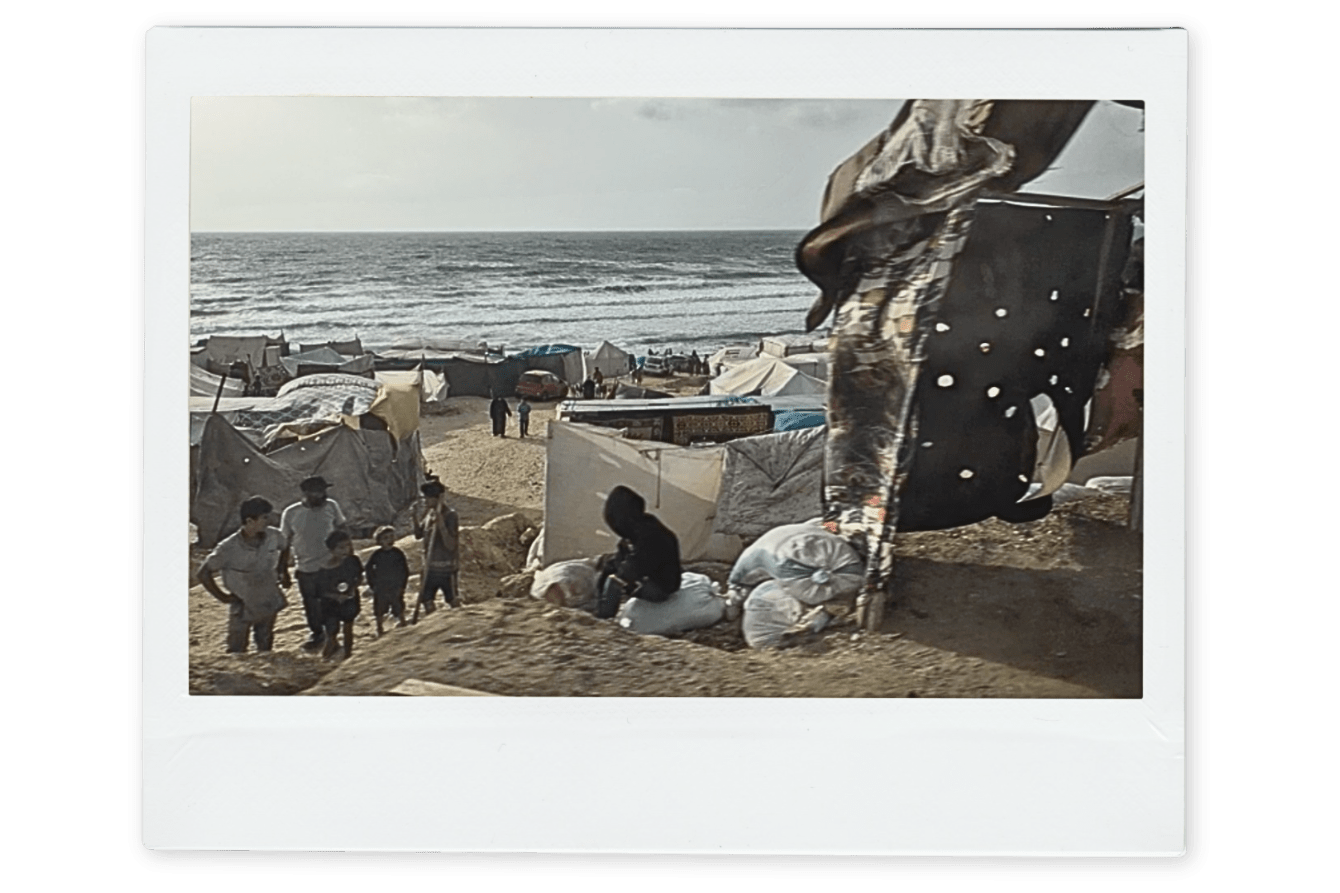 Displaced Palestinians on the beach in Gaza.