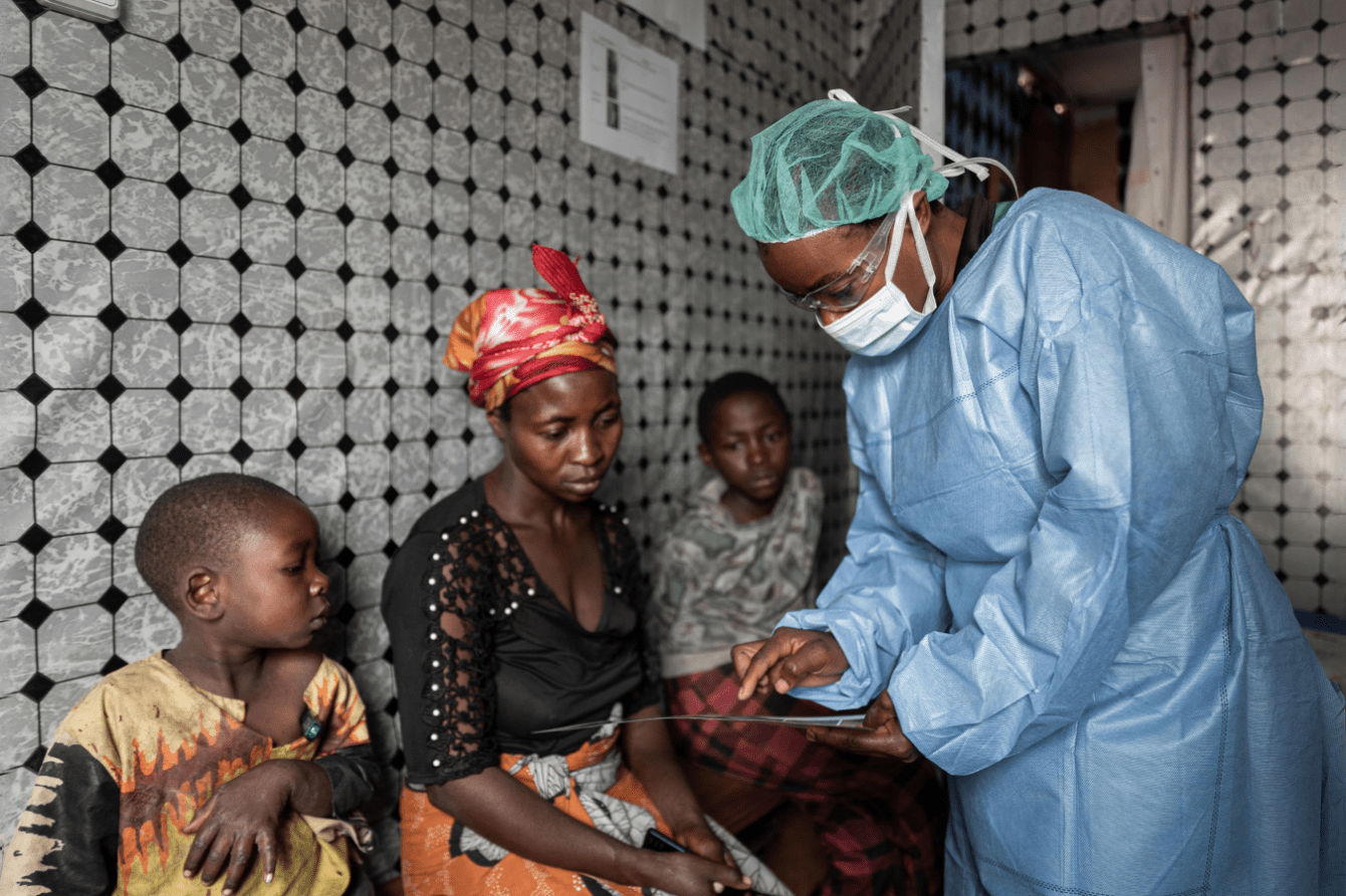 A doctor screens patients for mpox in DR Congo.