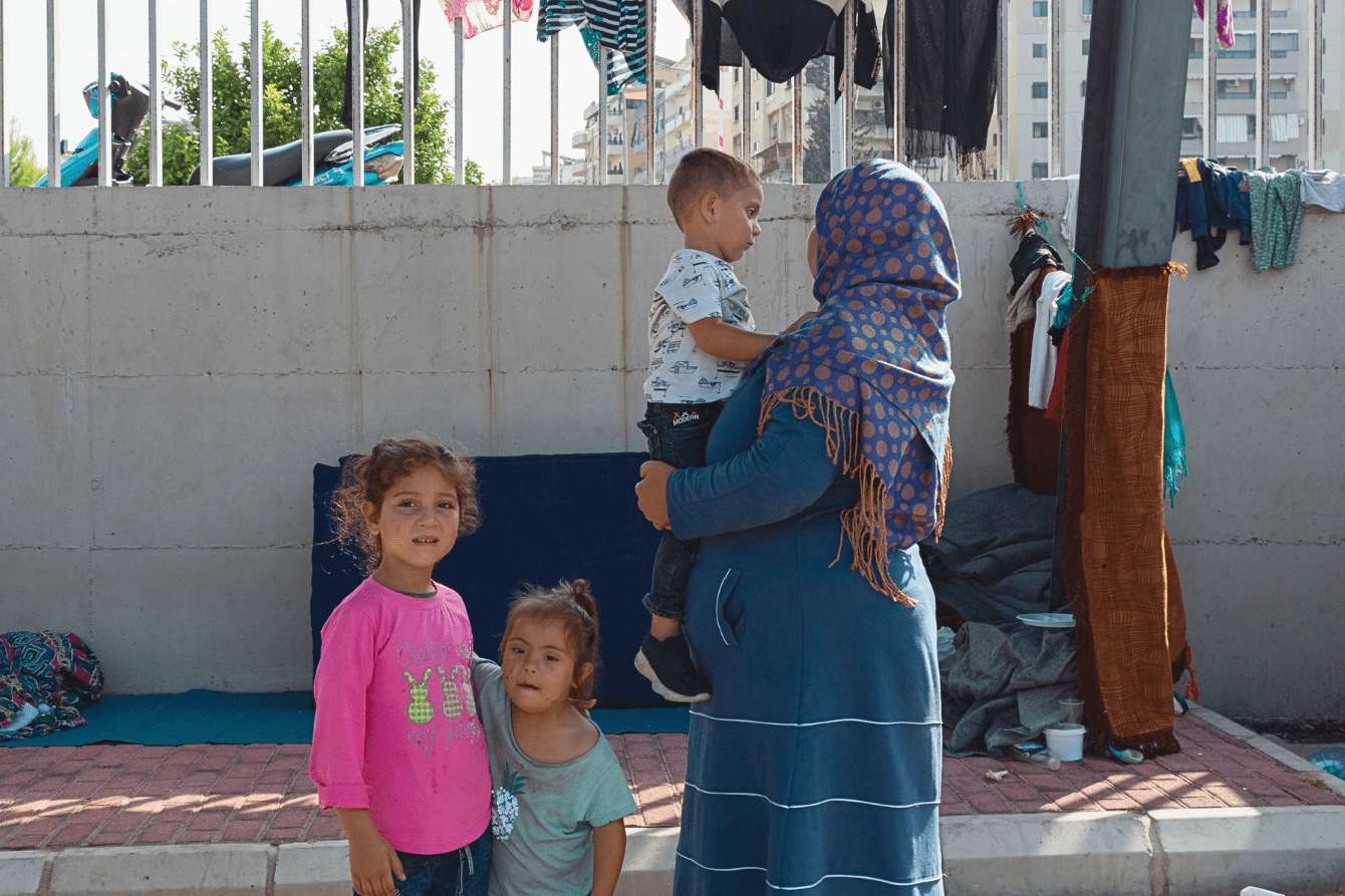 Hala, a Syrian refugee with her three children in Saida, Lebanon.