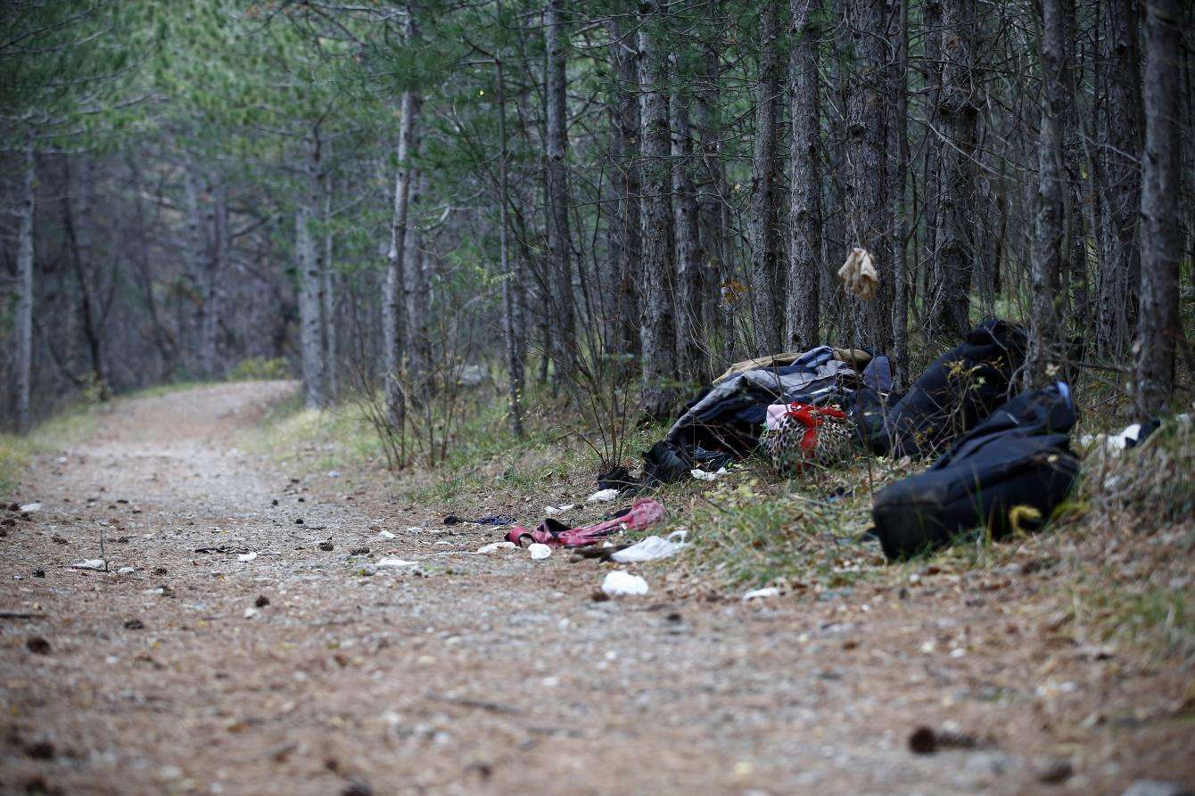 Clothes and makeshift shelter in the woods