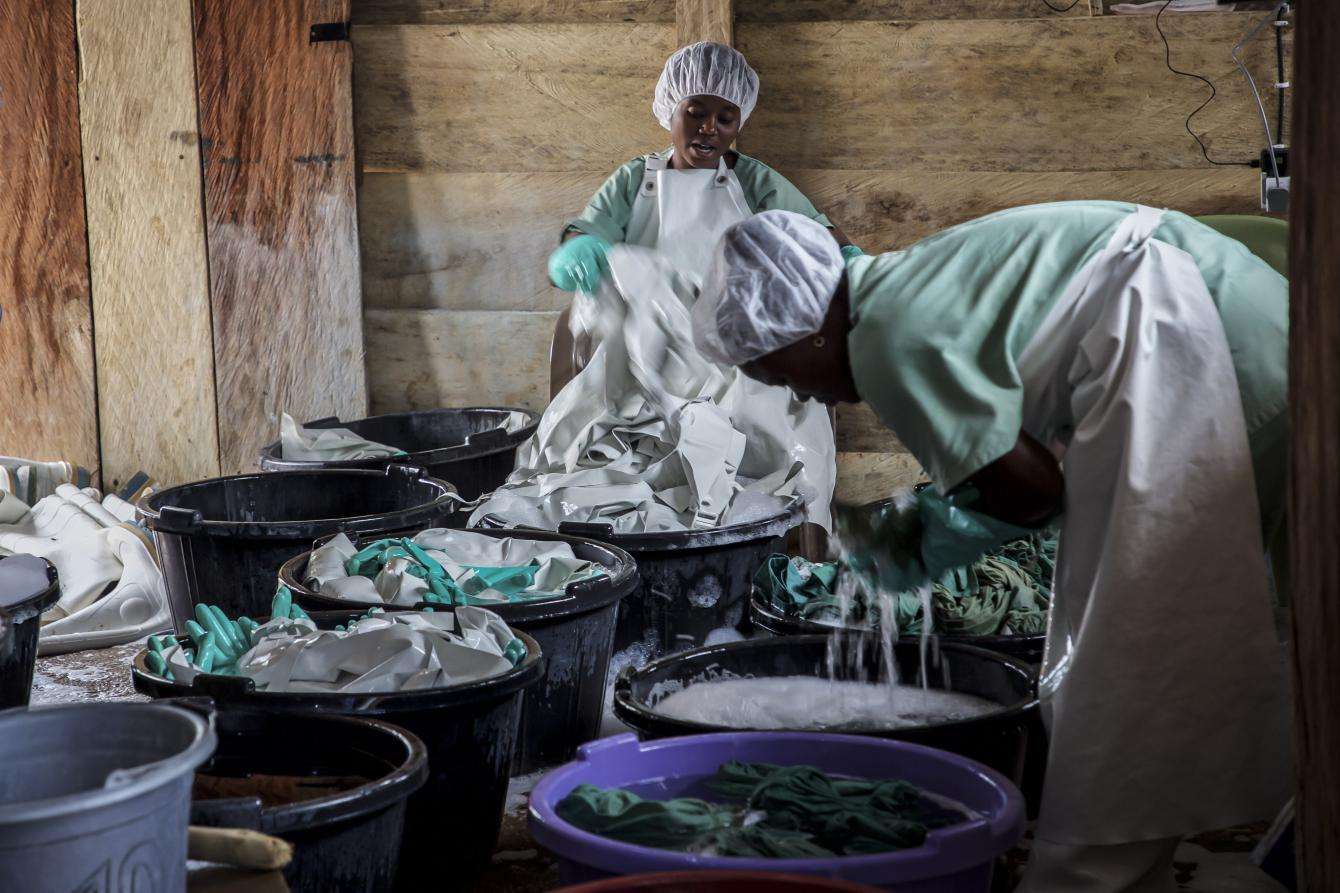 MSF hygienists sanitize personal protective equipment used by health workers at the Mangina Ebola treatment center, DRC.