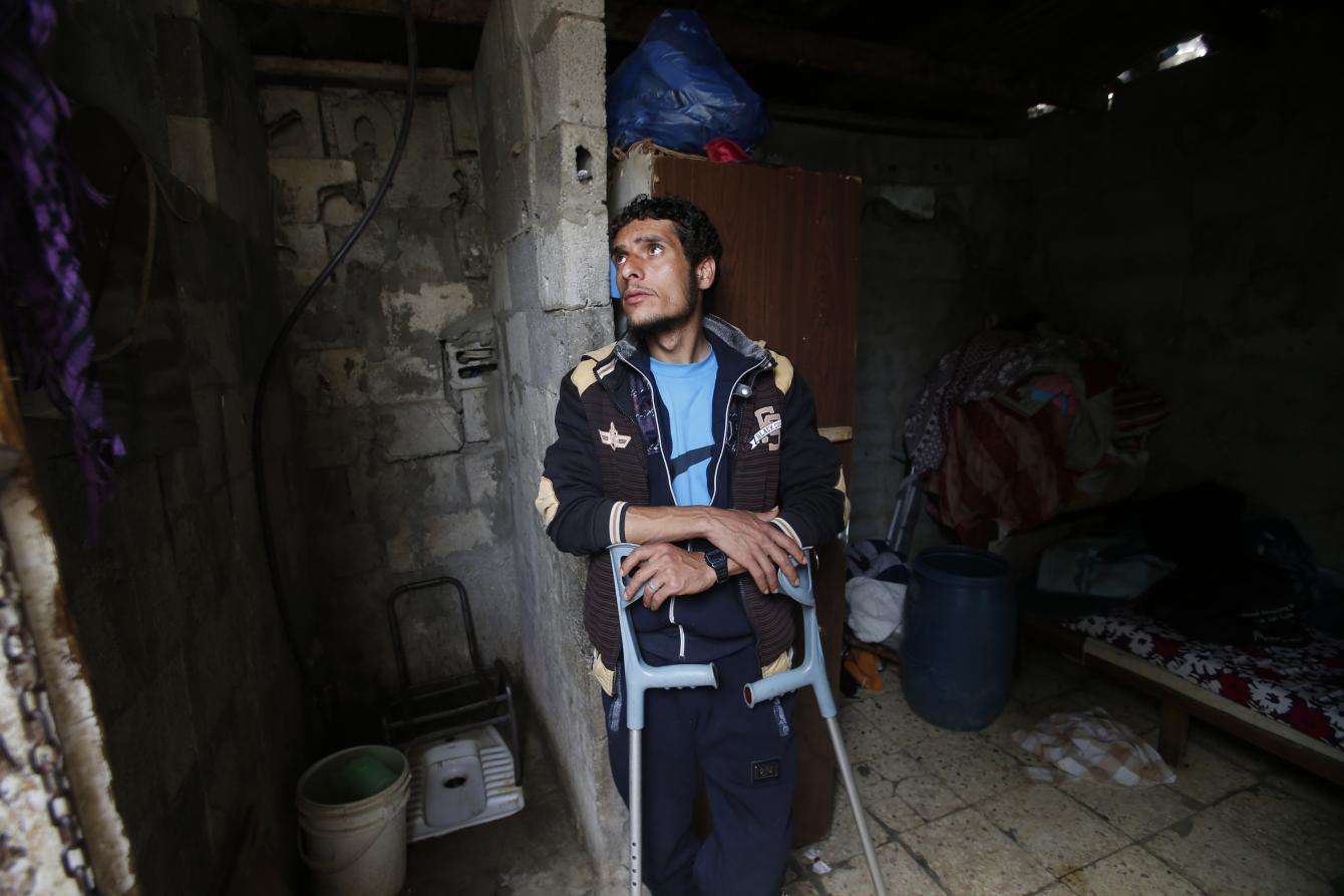 Murad, 26, pictured in the one-room house he shares with his mother on the outskirts of Gaza City.