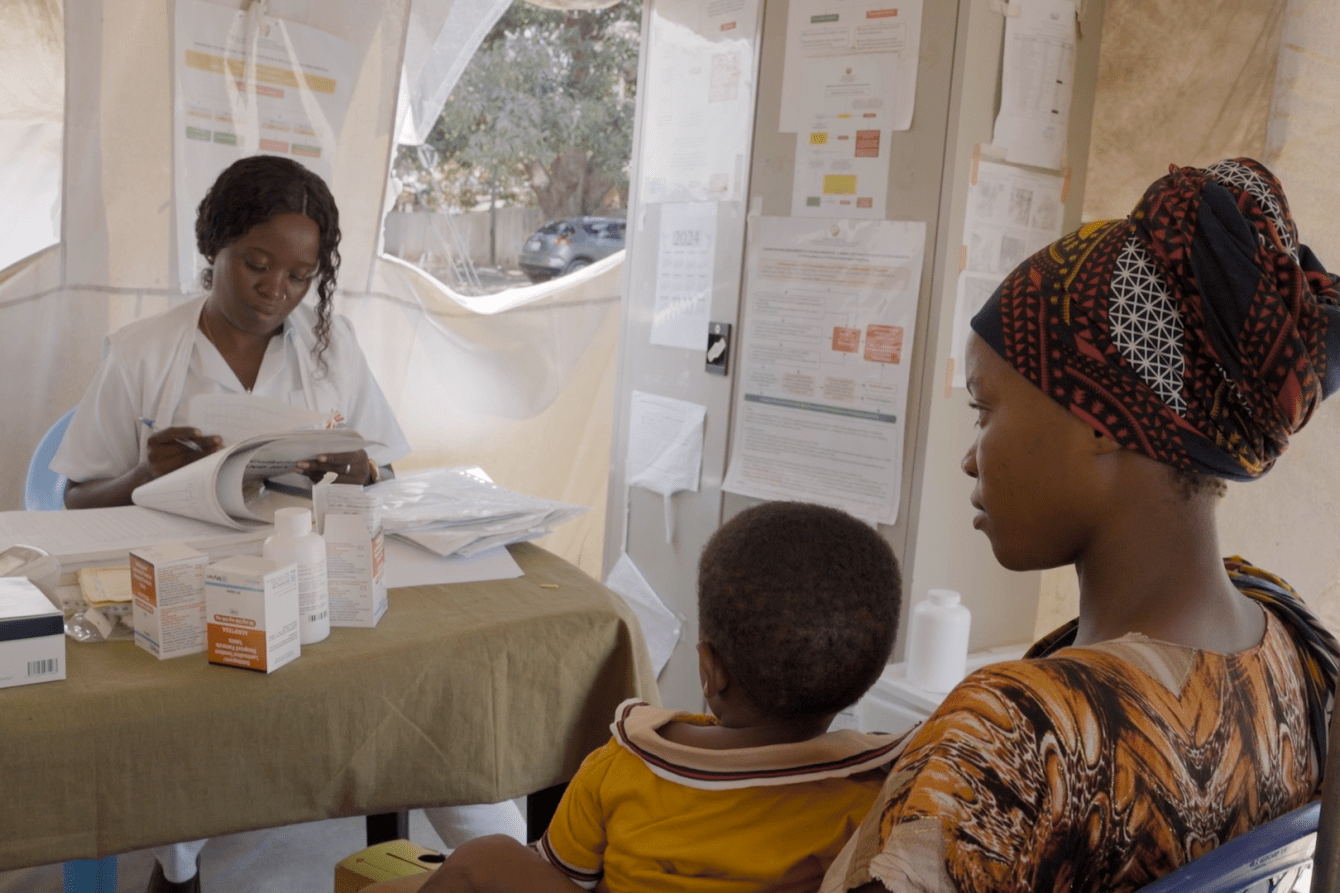 A doctor consults with a patient in Mozambique. 