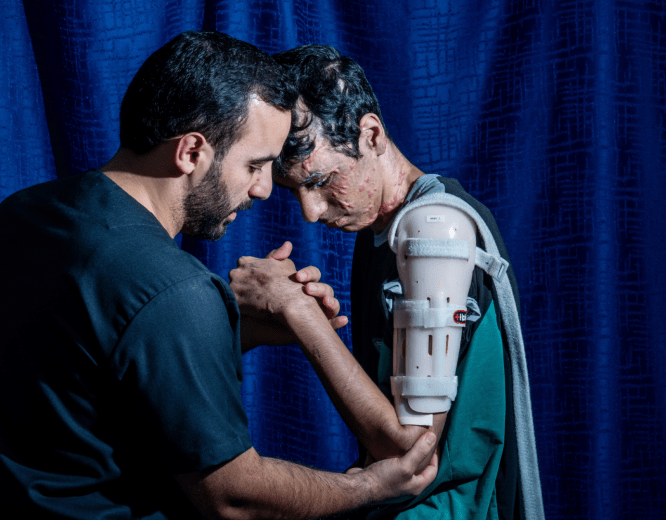 An injured Palestinian boy undergoes treatment from MSF in Jordan.